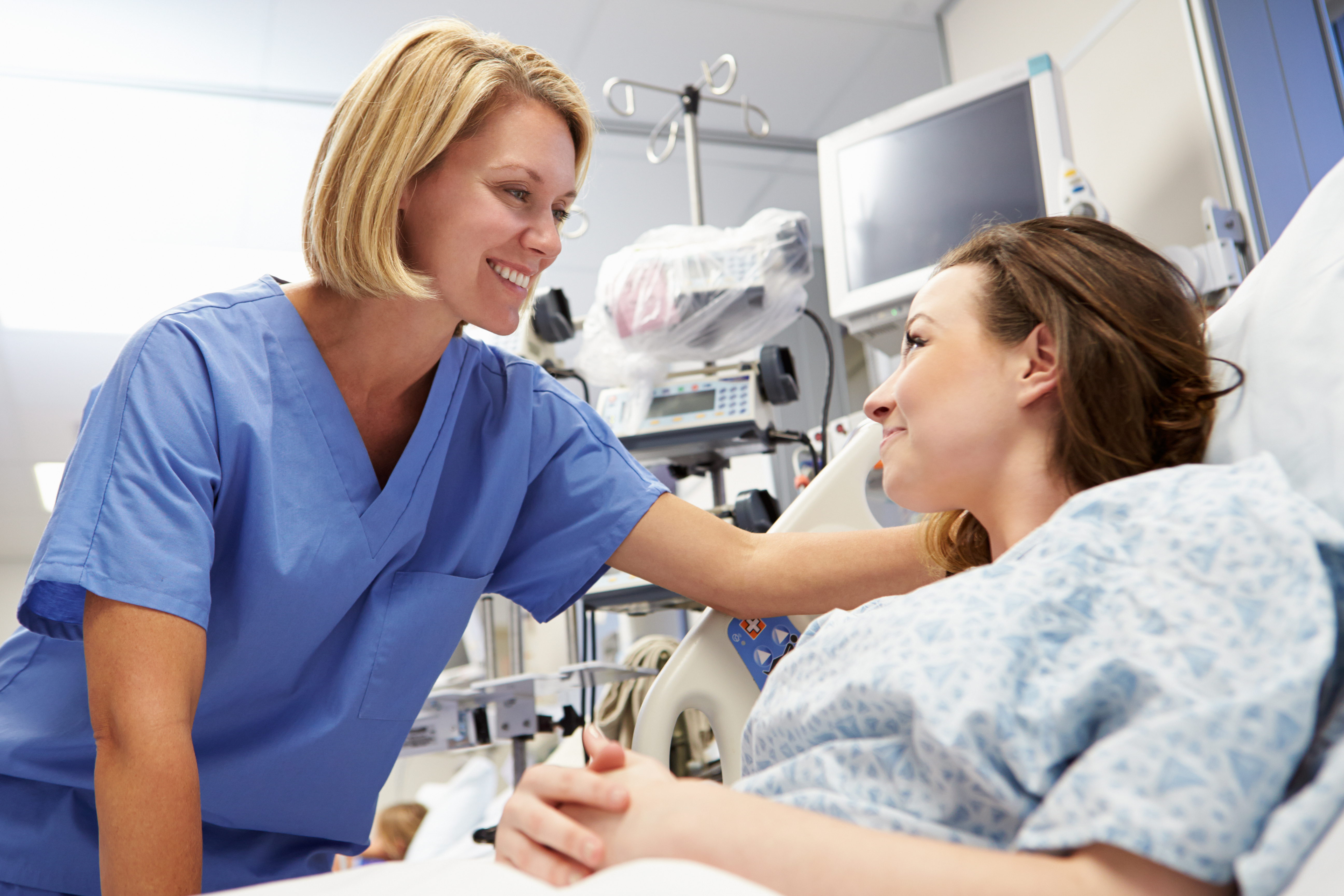 Physician and patient smiling at each other